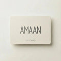 A Giftcard featuring the name “AMAAN” in bold black letters at the center, with “GIFTCARD” printed beneath, displayed on a plain background.